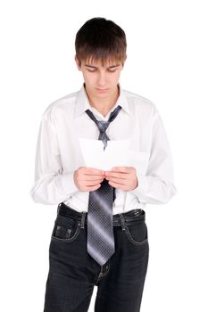 earnest teenager looking on torn paper. isolated on the white background