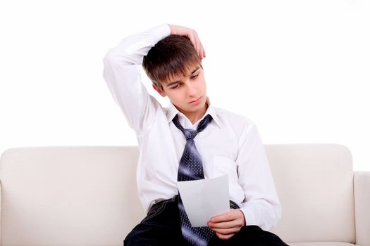 pensive teenager looking on the blank torn paper. isolated on the white background