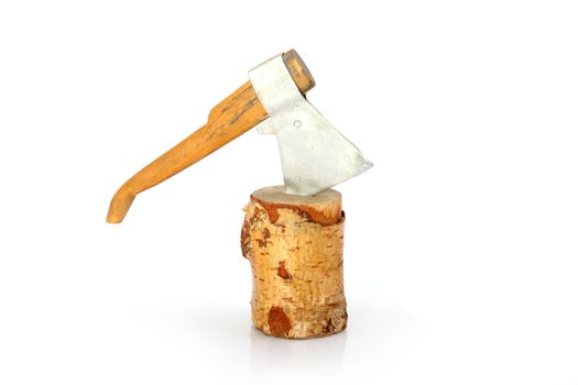 axe toy in stump closeup. isolated on the white background