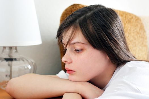 Sad Teenage Girl in Home interior