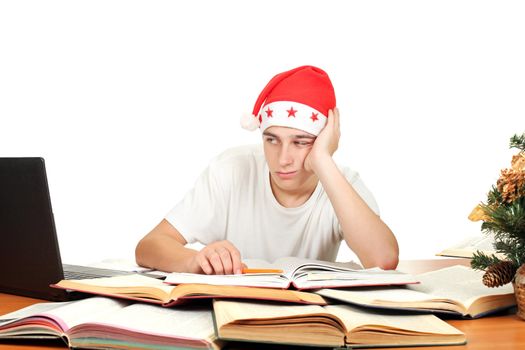 bored and tired student in santa's hat. isolated on the white background