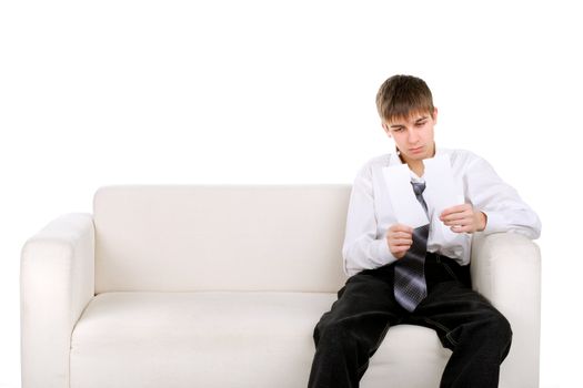 Pensive Teenager looking on the Blank torn Paper. Isolated on the White background