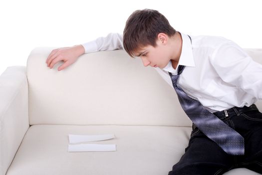 pensive teenager looking on the blank torn paper. isolated on the white background