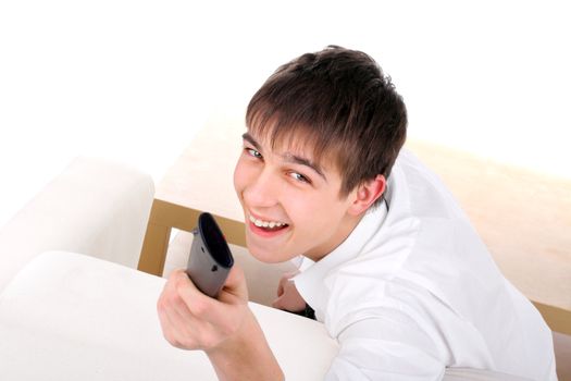 Cheerful Teenager with Remote Control on the Sofa