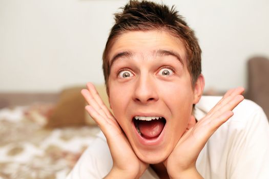 Amazed Teenager on the bed in Home interior