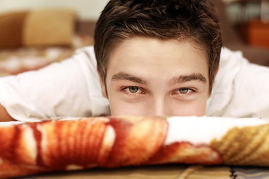 Young Man Portrait in the Bed closeup