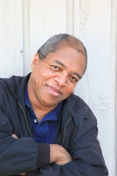 African American male posing outside.