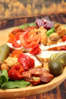 traditional romanian plate with pork sausage and vegetables