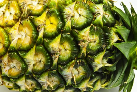 whole pineapple detail isolated on white background