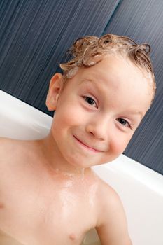 the boy is happy in the swimming bath