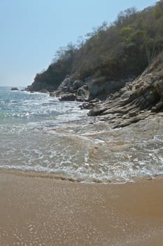 Waves on the beach at Chahue, Huatulco, Mexico