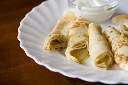 Pancakes on a plate with cream