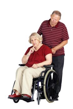 Elderly or senior couple with man caring for his wife in a wheelchair, looking sad or depressed, studio shot isolated over white background.