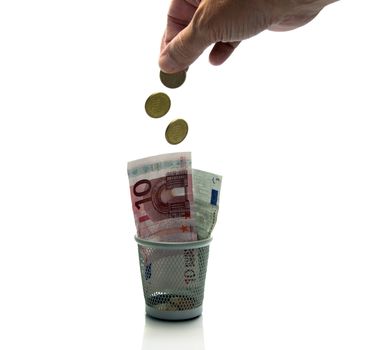 hand throws euro money in container