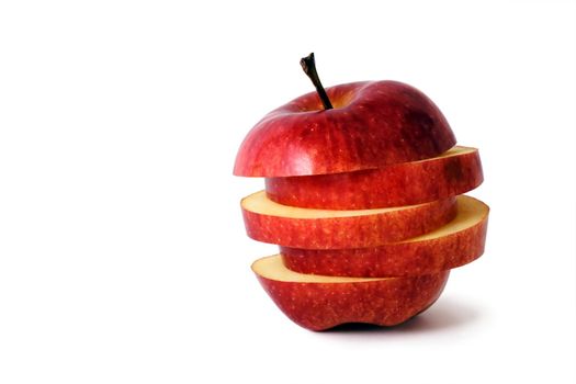 slices of an apple put together to form a hybrid fruit, shot on white in a studio