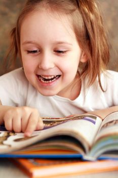 Smart girl reading a book and learns