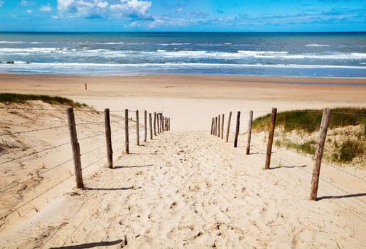 way to the sand beach on North sea in Netherlands