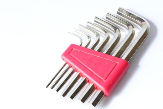 Isolated Allen wrench set with red holder.