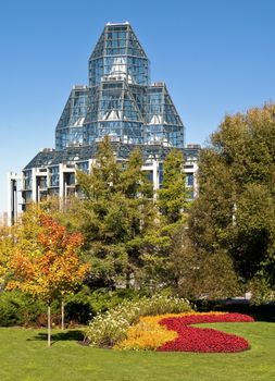The National Gallery of Canada in Ottawa stands proud surrounded by flowers and autumn colors.