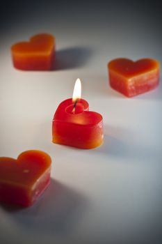 Heart-shaped candles. meaning of love or get married