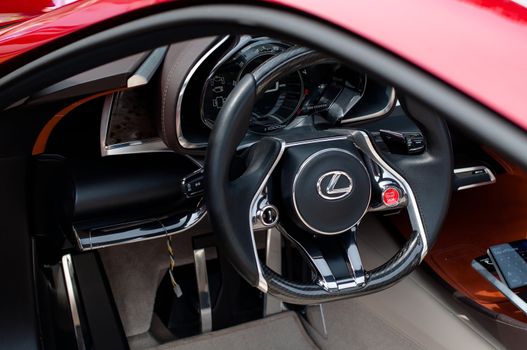 CERNOBBIO, LAKE COMO, ITALY – May 27: LEXUS showcasing their LF-Lc Concept car during the Concorso d'Eleganza Villa d'Este auto show in Cernobbio at the Lake Como in Italy on May 27, 2012. After making its world debut at the 2012 Detroit Auto Show, Lexus LF-Lc was presented again in Italy. The stunning Lexus LF-Lc Concept features a glass roof and an extensive remote touch-screen control board and infotainment touch screen display integrated into the doors. Concorso d'Eleganza Villa d'Este is a well renowned elegance competition for classic and vintage cars. It has taken place every year since 1929 and is also used by car manufacturers for presenting new prototypes.