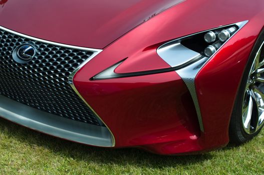 CERNOBBIO, LAKE COMO, ITALY – May 27: LEXUS showcasing their LF-Lc Concept car during the Concorso d'Eleganza Villa d'Este auto show in Cernobbio at the Lake Como in Italy on May 27, 2012. After making its world debut at the 2012 Detroit Auto Show, Lexus LF-Lc was presented again in Italy. The stunning Lexus LF-Lc Concept features a glass roof and an extensive remote touch-screen control board and infotainment touch screen display integrated into the doors. Concorso d'Eleganza Villa d'Este is a well renowned elegance competition for classic and vintage cars. It has taken place every year since 1929 and is also used by car manufacturers for presenting new prototypes.