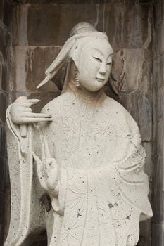 one of the eight statues of gods, according to chinese beliefs, found in a chinese temple.