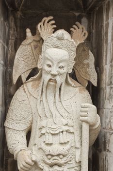 one of the eight statues of gods, according to chinese beliefs, found in a chinese temple.