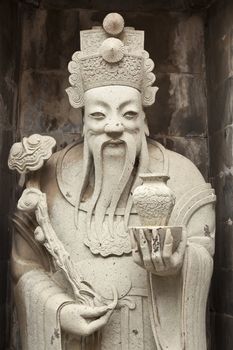 one of the eight statues of gods, according to chinese beliefs, found in a chinese temple.