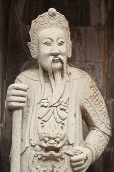 one of the eight statues of gods, according to chinese beliefs, found in a chinese temple.