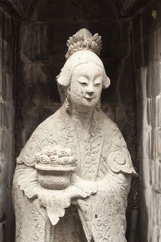 one of the eight statues of gods, according to chinese beliefs, found in a chinese temple.