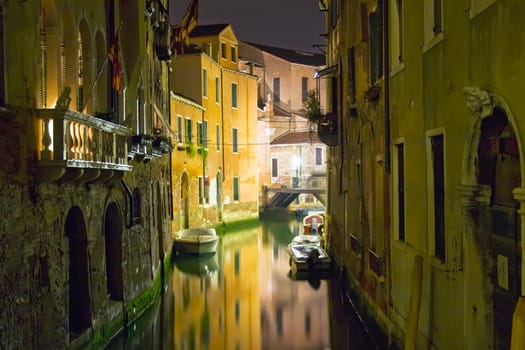 View of a canal in Venice during night