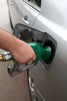 Person fulling a car with petrol