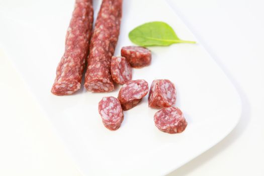 traditional Dutch sausages from dry meat on white plate