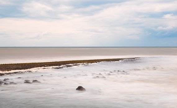 cold North sea and clouded sky