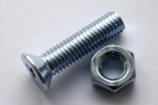 The large bolts and screws on a white background.