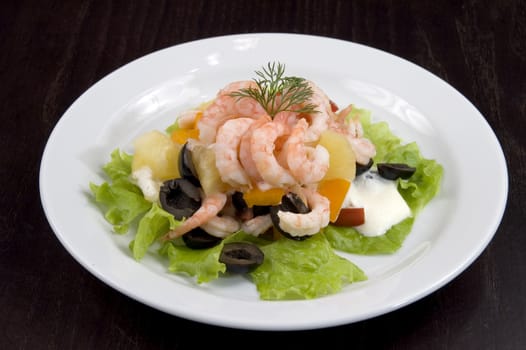 Prawn salad. Simple and healthy salad of shrimp, mixed greens, red  pepper and olive.