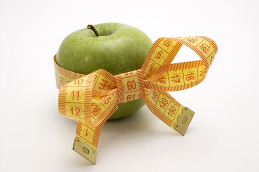 Green Apple with measuring tape.