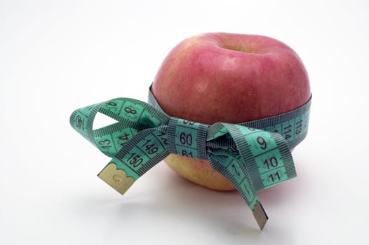 Red Apple with measuring tape.