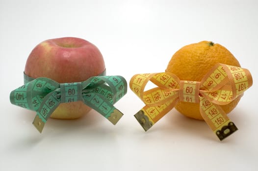 Apple and  bright orange  with measuring tape.