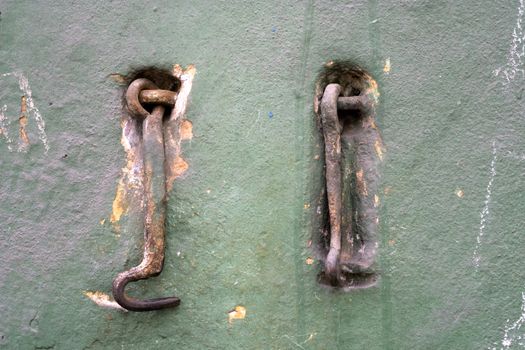 Two old metal hooks.