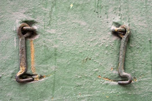 Two old metal hooks.