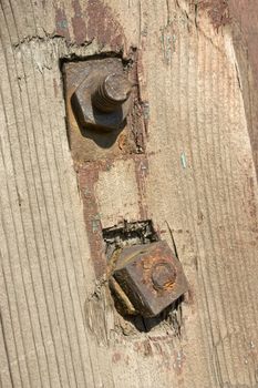 Old metal details on an old board.