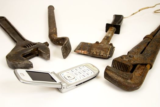 Old  tools and modern telephone.