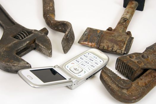 Old  tools and modern telephone.