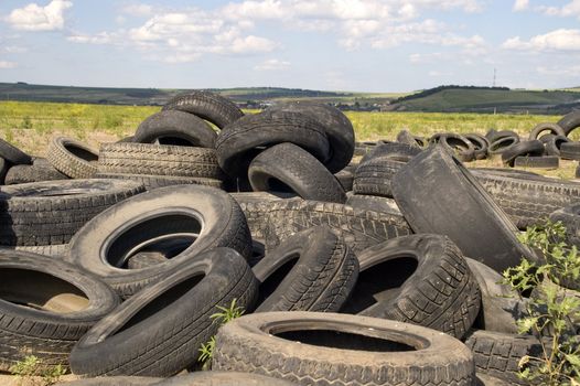 Heap of the old worn out automobile tyre covers.