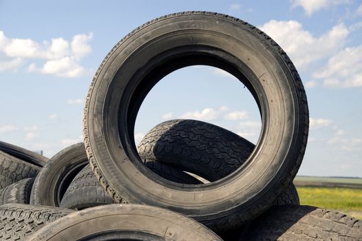 Heap of the old worn out automobile tyre covers.