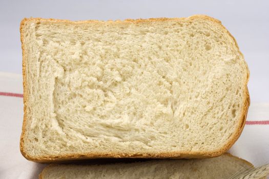 Background of fresh bread. The Piece of bread.