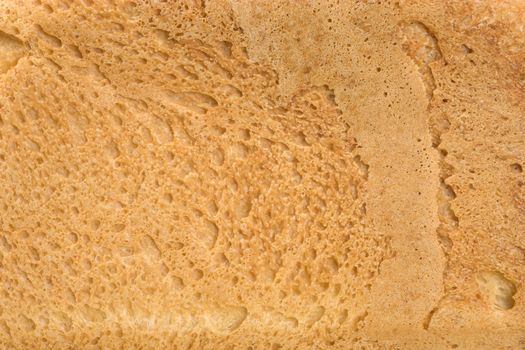 Background of fresh bread. The Piece of bread.