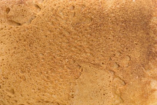 Background of fresh bread. The Piece of bread.